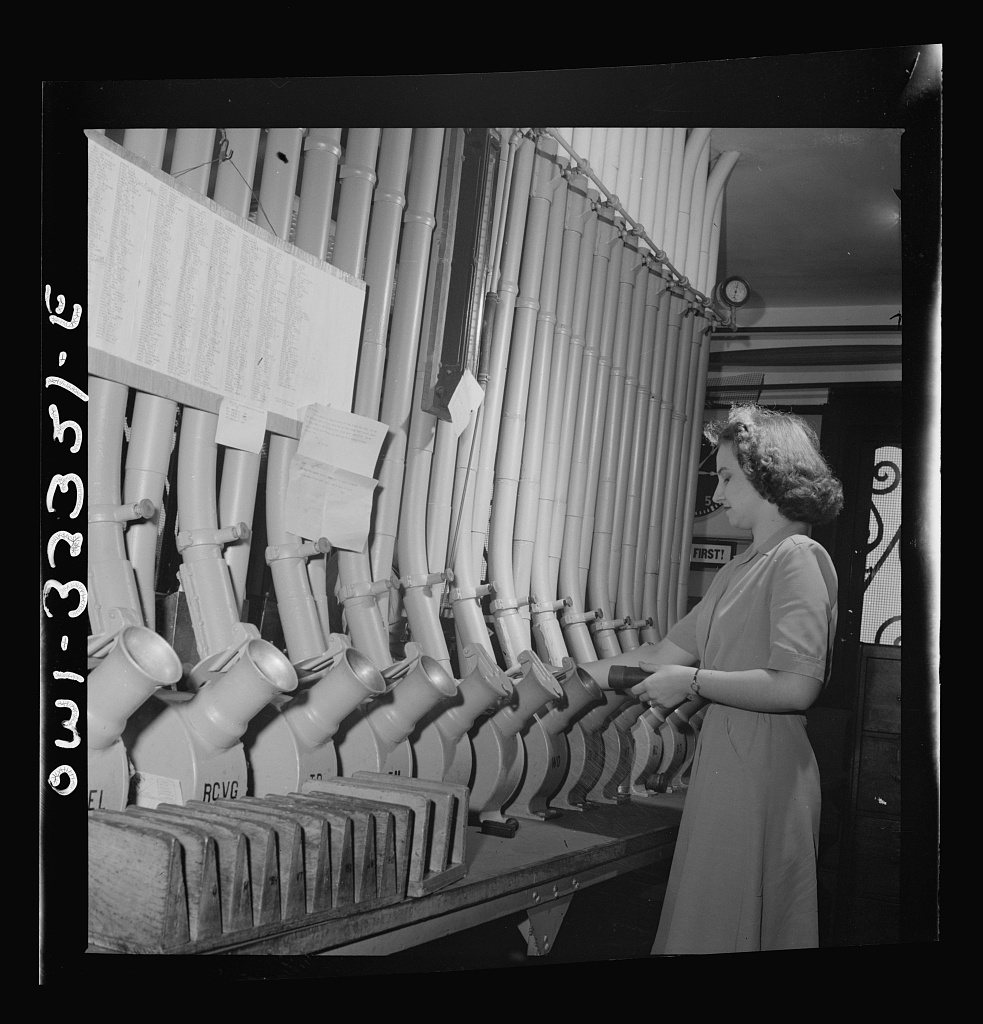 Helen Ringwald working a pneumatic tube terminal in Washington, D.C., June 1943, photographed by Esther Bubley for the Office of War Information